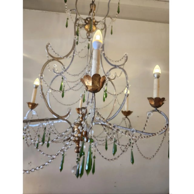 Chandelier inspired by the rustic, old-world design traditions of the Tuscany region in Italy. It’s meant to evoke the...