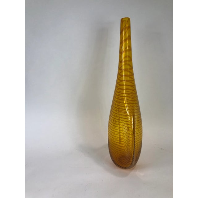 A modern glass gold color vase - Signed John Geci. Please view our additional listings for the red and/or the blue option.