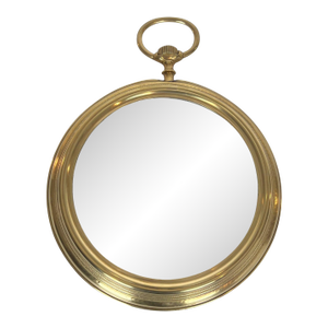 Large brass mirror representing a pocket watch. French work. Circa 1970