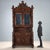 Neo-Baroque walnut sideboard, finely carved, from late 19th century Italy. The upper section features a pair of leaded...