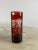 Bottle set with six lead crystal glasses, red color. The bottle has its cap, always ijn glass. All the pieces are engraved...