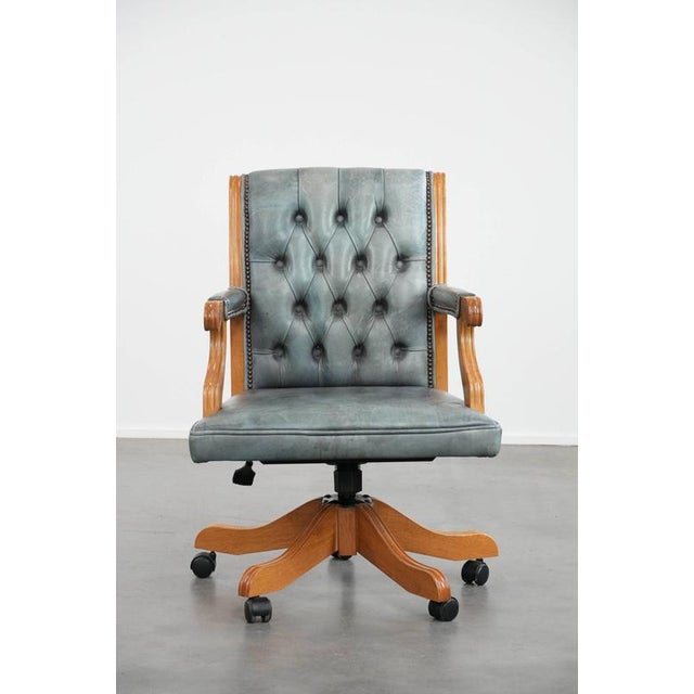 Stunning and unique light blue cowhide and wood classic English-style Chesterfield office chair on casters. : This...
