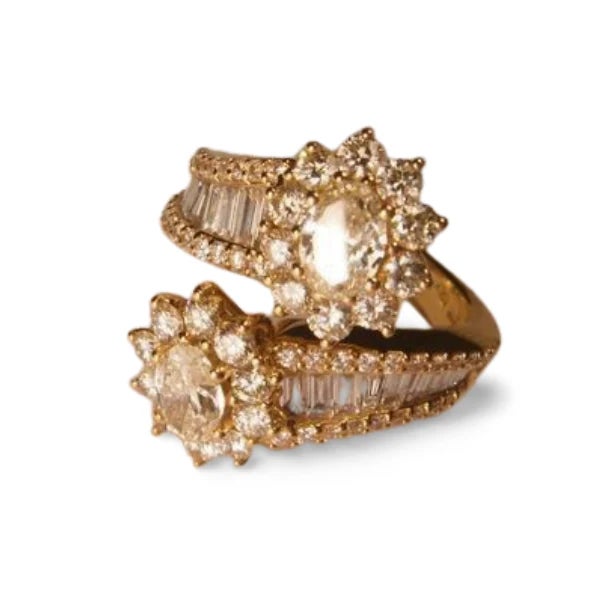 18K Yellow Gold Oval Solitaire Diamond Bypass Cocktail Ring. This elegant cocktail ring features a striking oval solitaire...