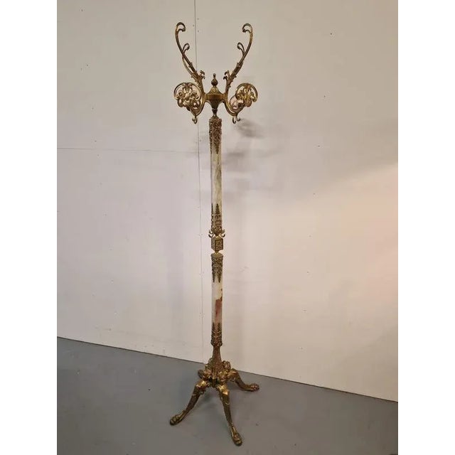 Luxurious floor rack.Onyx, brass.France.1970s.Dimensions: height 176cm; 39x39cm