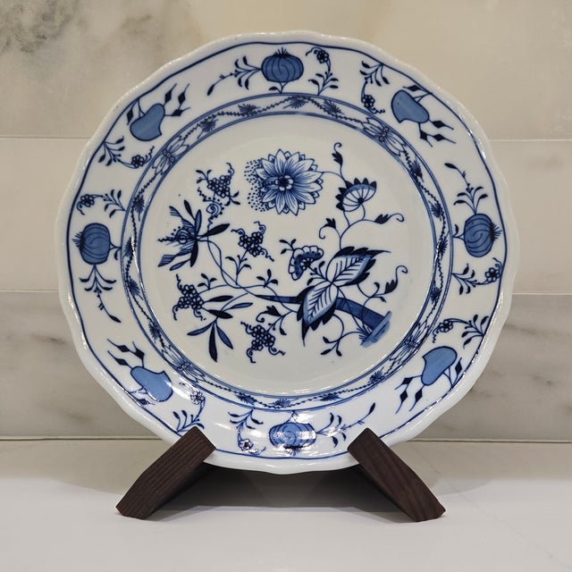Own an iconic classic with this set of three vintage Meissen “Blue Onion” porcelain plates, made in Germany and marked...