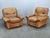 Elegant pair of Italian lounge armchairs produced by Arcon Italia during the 1970s. Crafted from high-quality cognac...