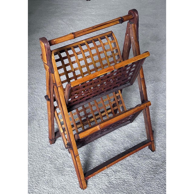 Burnt Bamboo folding magazine stand. Easy to move from room to room. And slide into a closet when not needed. Measures 26"...