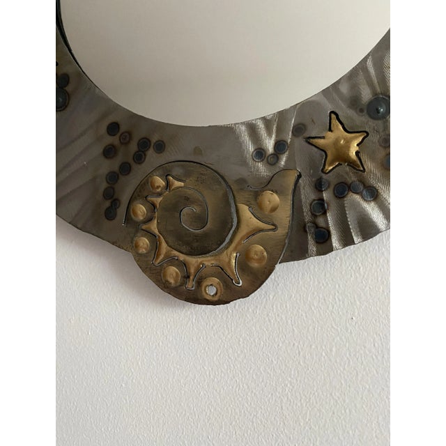 Charming unique wall mirror. This handmade piece has an attractive steel frame, supporting circular mirror glass. Inspired...