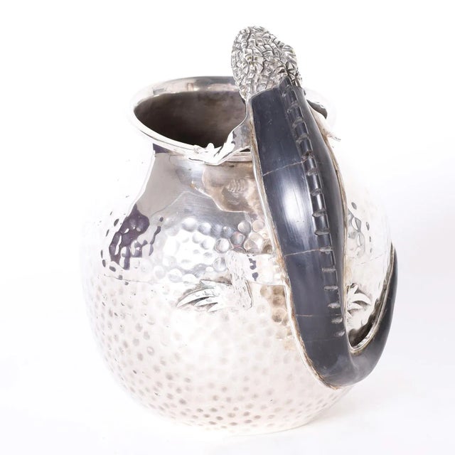 Eye catching mid century silver plate on copper hand crafted pitcher featuring a lizard handle with a black stone back....
