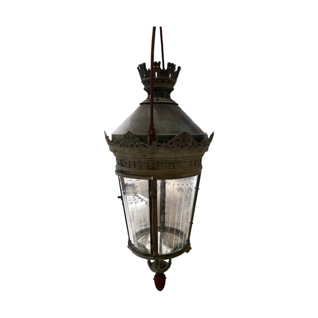 This Italian antique lantern, dating to the 1800s, is distinguished by its castle motif detailing, a romantic reference to...