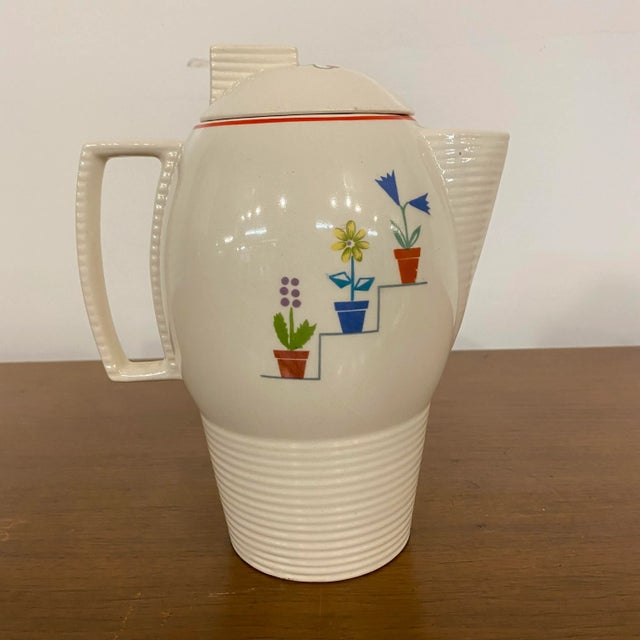 Viktor Schreckengost Ceramic Pitcher with painted floral detailing. There is no makers mark but we believe this is a...