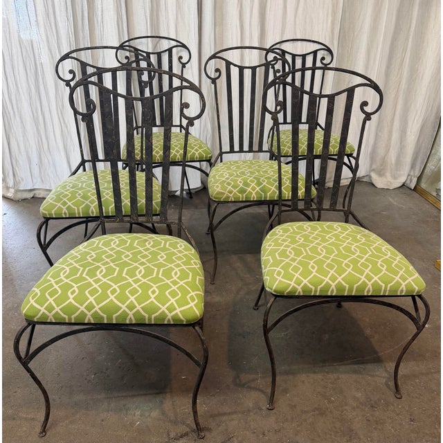 Set of six vintage wrought iron dining chair featuring a distinctive high back with an open-top scrollwork crest, vertical...
