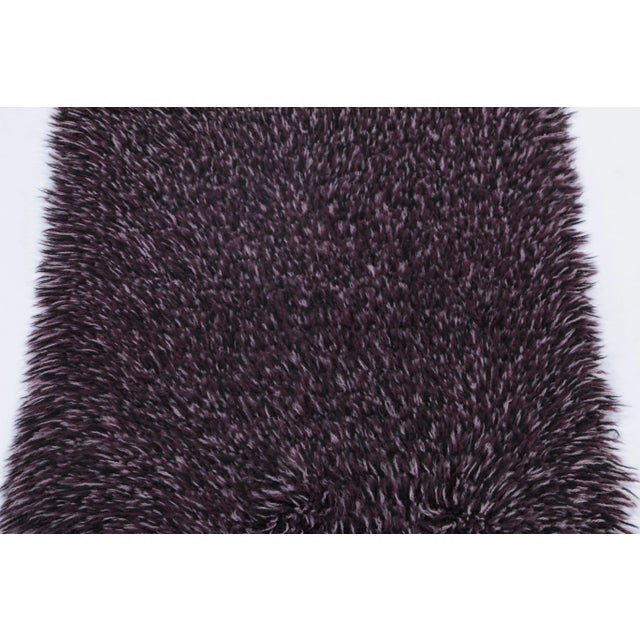 Hand-knotted in lush, high-pile wool in Sweden circa 1960-1970, this 2x4 vintage Swedish Rya runner rug is a bold new...