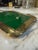 Striking vintage tray featuring a sculptural, hand-formed brass frame paired with a rich green glass inset. The organic,...