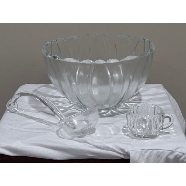 Vintage glass punch bowl set Includes glass bowl, glass ladle and 18 matching glass cups Rarely used and no signs of wear...