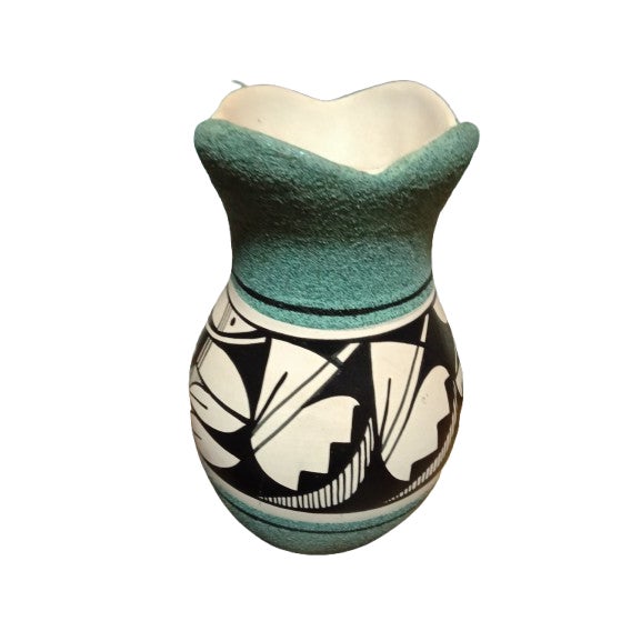 The Mitzi Drake Navajo Sand Pottery is a handmade 3 piece jar set of Native American pottery from the United States,...