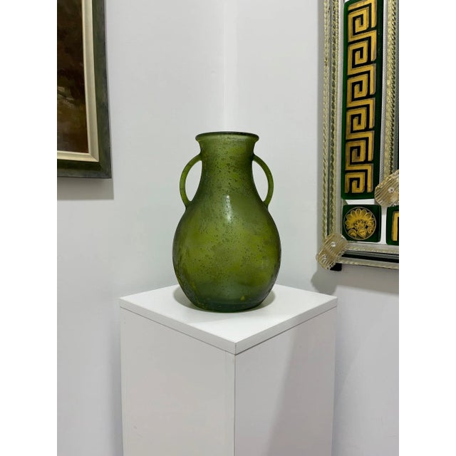 This lovely piece is believed to be Murano Glass, but there are no markings to be found. Beautiful scavo green coloring. A...