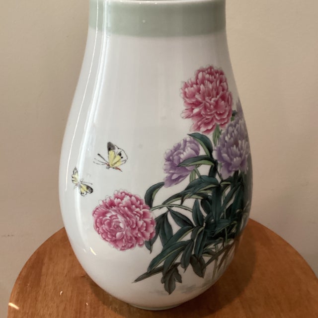 This large Qing Dynasty Famille Rose hand painted peonies vase with calligraphy is a stunning piece of antique porcelain...