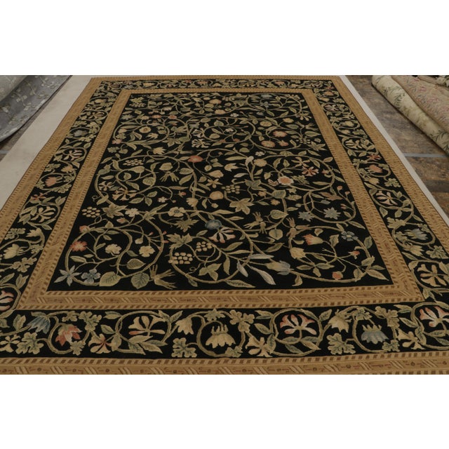 Hand-knotted in wool, this 9x11 European rug in black is the first iteration of this design to be in high-and-low texture....