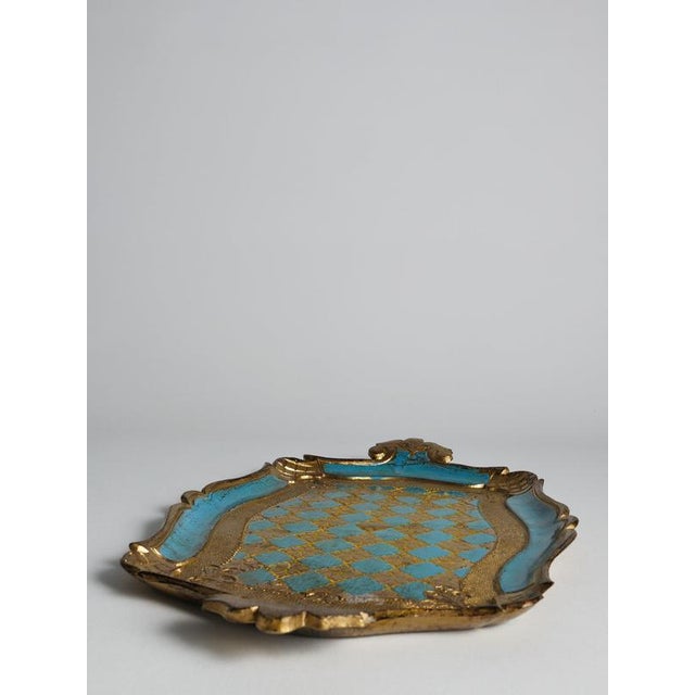 A striking mid-20th-century florentine tray in the traditional rococo style, produced in italy circa 1950–1970....