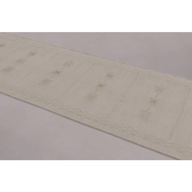Handwoven in a blend of wool and undyed natural yarns, this 4x13 runner is from the contemporary flatweaves in Rug &...
