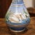 This elegant antique vase was created in France circa 1880 by "Porcelaine de Paris" factory. Round in shape with a long...