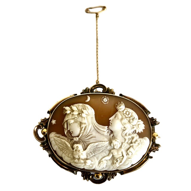 This exquisite Victorian cameo brooch, dating to circa 1860–1880, features a beautifully detailed carving of the famous...