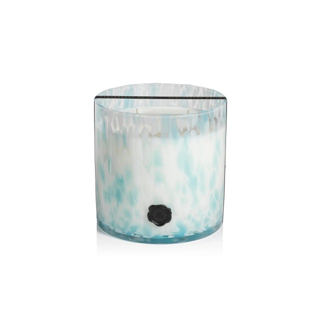 Infuse a luxury fine fragrance and light into your home with this lovely candle. Its elegant glass jar design with seal...