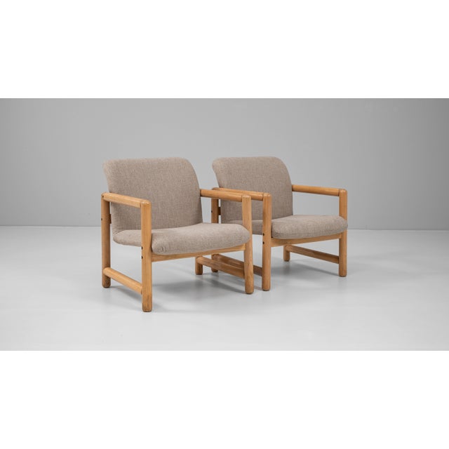 Pair of 20th Century Czech upholstered armchairs. These mid-century armchairs feature cylindrical beechwood frames with...