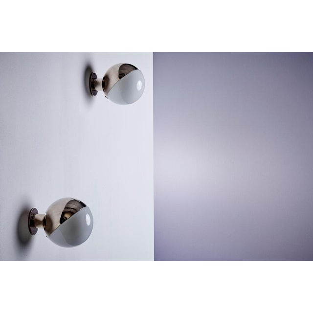 Elegant pair of Danish wall lamps designed by Vilhelm Lauritzen in the 1940s for Louis Poulsen. Model 10630 features a...
