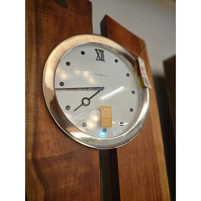 This Otto Floor Clock features two planks of rustic live edge Acacia hardwood slabs with knots, raw edges, and machine...