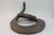 A cut steel form of a coiled rattlesnake, circa 1970. Difficult to make out the full signature but it looks like a last...