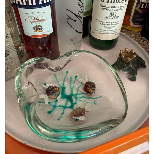 Rare and spectacular piece! This is a fabulous, heavy, Murano art glass bowl/ashtray with three swimming iridescent fish...