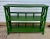 A mid-century two-tier rattan étagère, newly painted in green with layered glazes and a fine fly speckle that give it an...