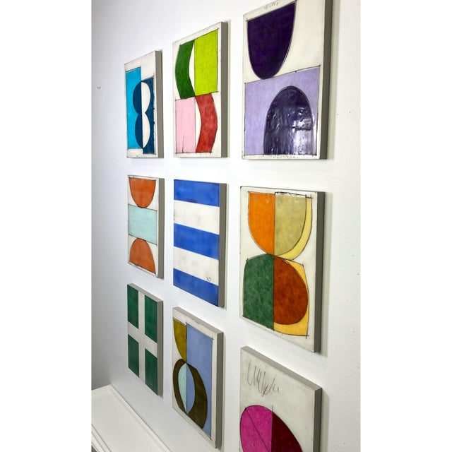 Nine 12x9 cradled wood panels make up this encaustic mixed media art piece. In the photo they are hanging spaced...