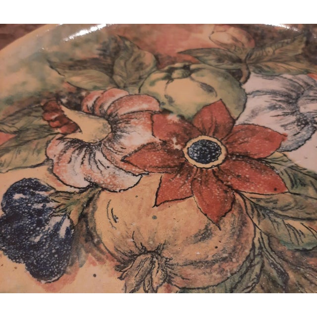 Introducing a stunning Hand-Painted Floral Clay Wall Plate from Mexico! This exquisite piece showcases a vibrant majolica...