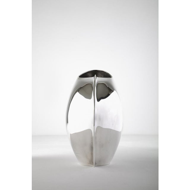 silver sculpture vase, mod. Prolix, signed by the author on the side and stamped sabattini on the base. Production lino...