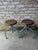 Pair of vintage artists stools on blue metal bases with round dark wood tops. These industrial metal stools have an...