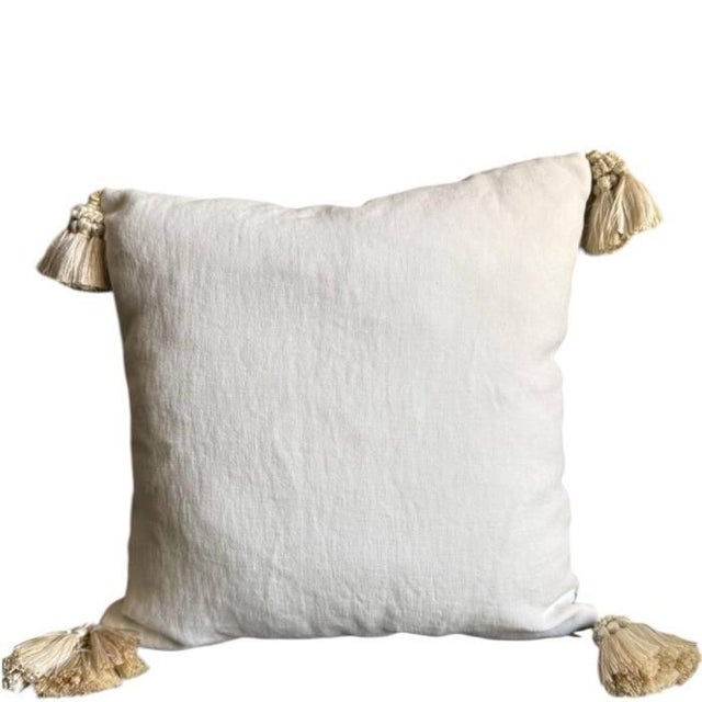 A multicolor printed linen from Manuel Canovas embellished with unique artisan embroidery from Casablanca in a burnt...