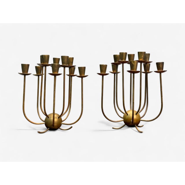 Swedish Modern, Patinated Brass, Candelabra, Sweden, 1950s Pair of heavily patinated brass candelabra designed and...