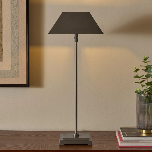Illuminate your space with the sophisticated LLEO table lamp. Standing at 25 inches, this stunning piece offers a sleek...