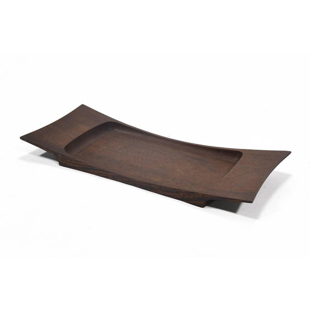 A stunningly beautiful design by Jens Quistgaard from Dansk's "Rare Woods" collection, this sculptural tray is crafted of...