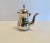 This coffee pot was purchased in the Middle East in the 80s. The silver is in need of some attention, although perhaps...