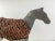 This endearing horse is made of metal with a wicker center. The metal has a time worn patina that adds to its charm. This...