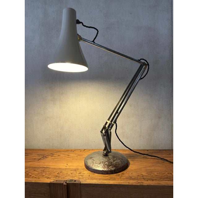 A british design classic model 90 anglepoise table lamp, designed by george carwardine. george carwardine was a british...