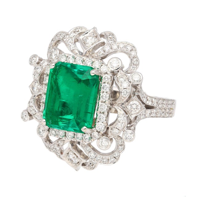 18k white gold Art Deco-inspired cocktail ring mounts this vibrant GIA certified 3.75 carat Colombian Emerald center stone...