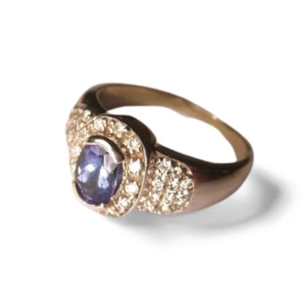 Material: 14K White Gold Gemstones: 1 Oval Natural Tanzanite 0.8 carats, Round Brilliant Diamonds 0.5 carats total Design:...