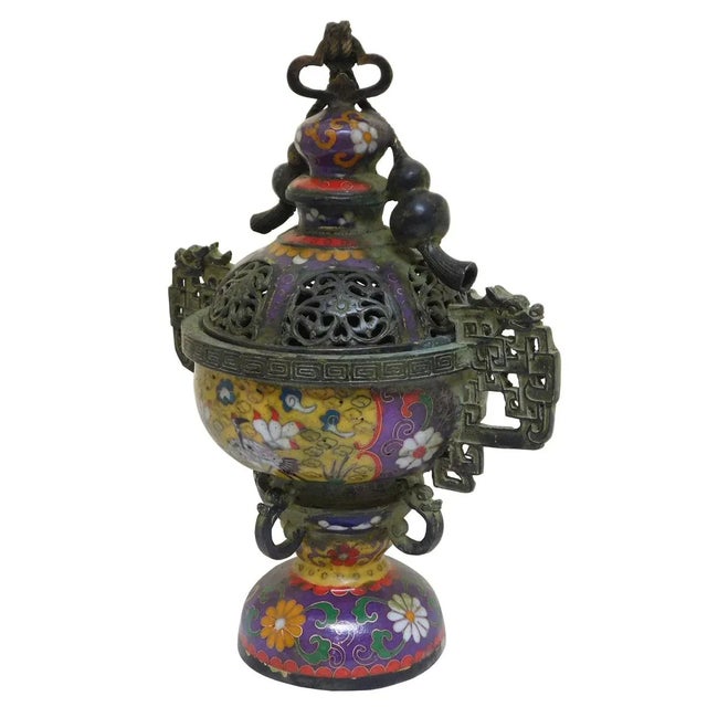 This is a traditional oriental Chinese incense burner made of metal and covered with yellow purple multi-color enamel...
