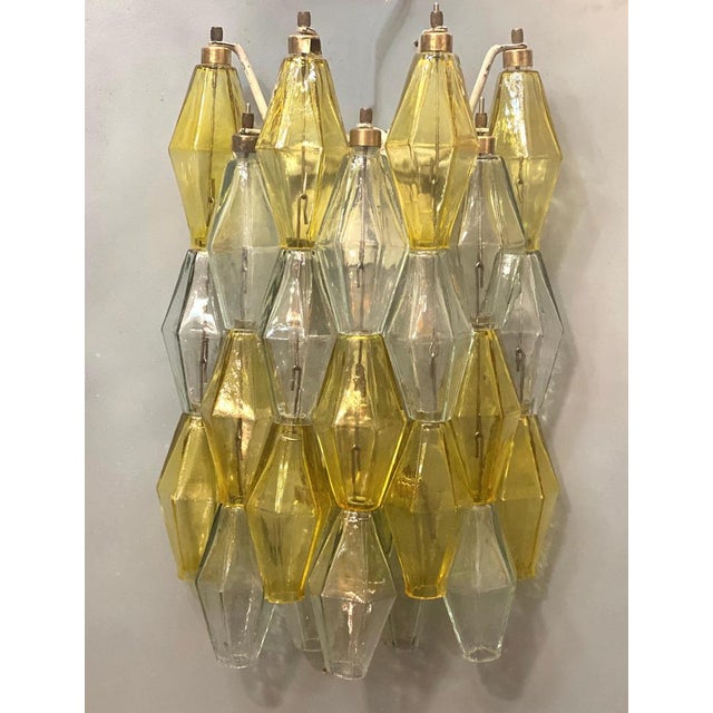 Amazing pair of poliedri wall lights. Rare combination of yellow amber and light blue color Murano glass. Available four...