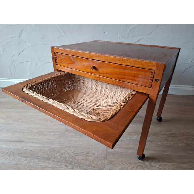 High-quality Danish sewing trolley in teak from around 1960. Large drawer with individual divisions, including a pull-out...